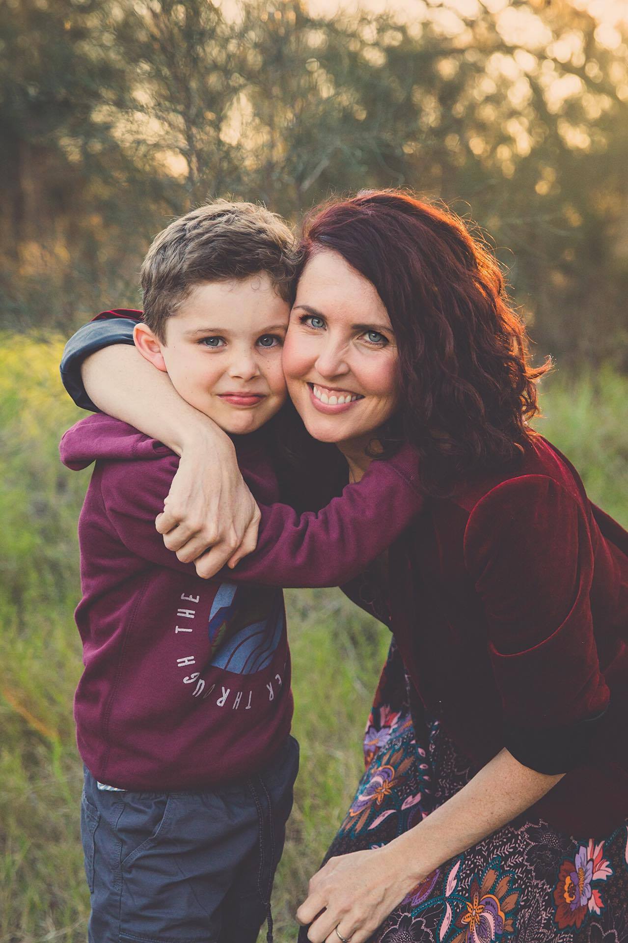 Postgraduate student Laura Engfors with her arm around a child